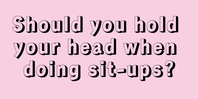 Should you hold your head when doing sit-ups?